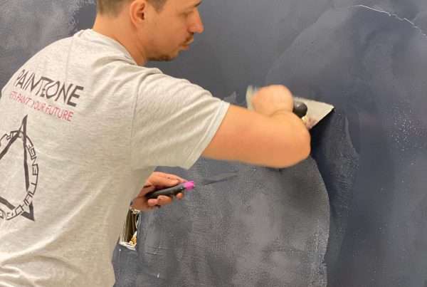 Process of roman clay application on accent wall