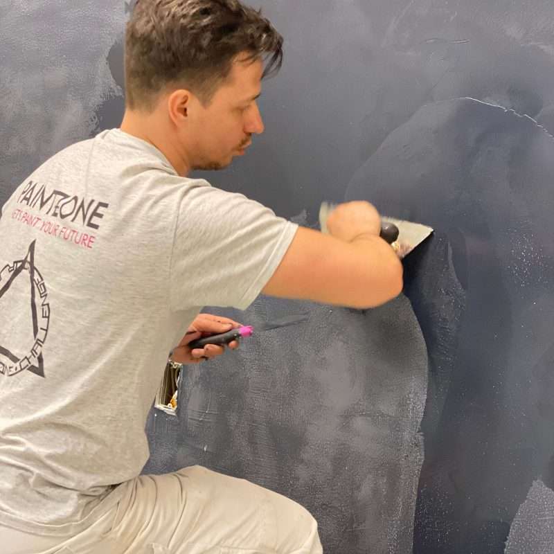 Process of roman clay application on accent wall